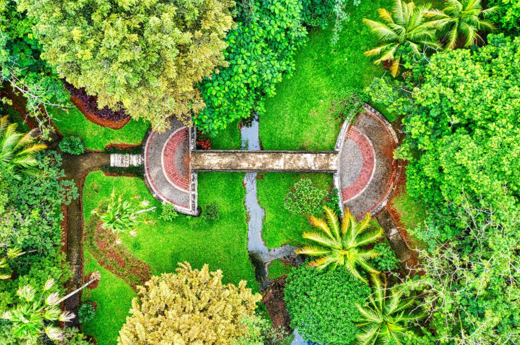 Stunning aerial view of a vibrant garden in Banten, Indonesia, showcasing lush greenery and architectural pathways.
